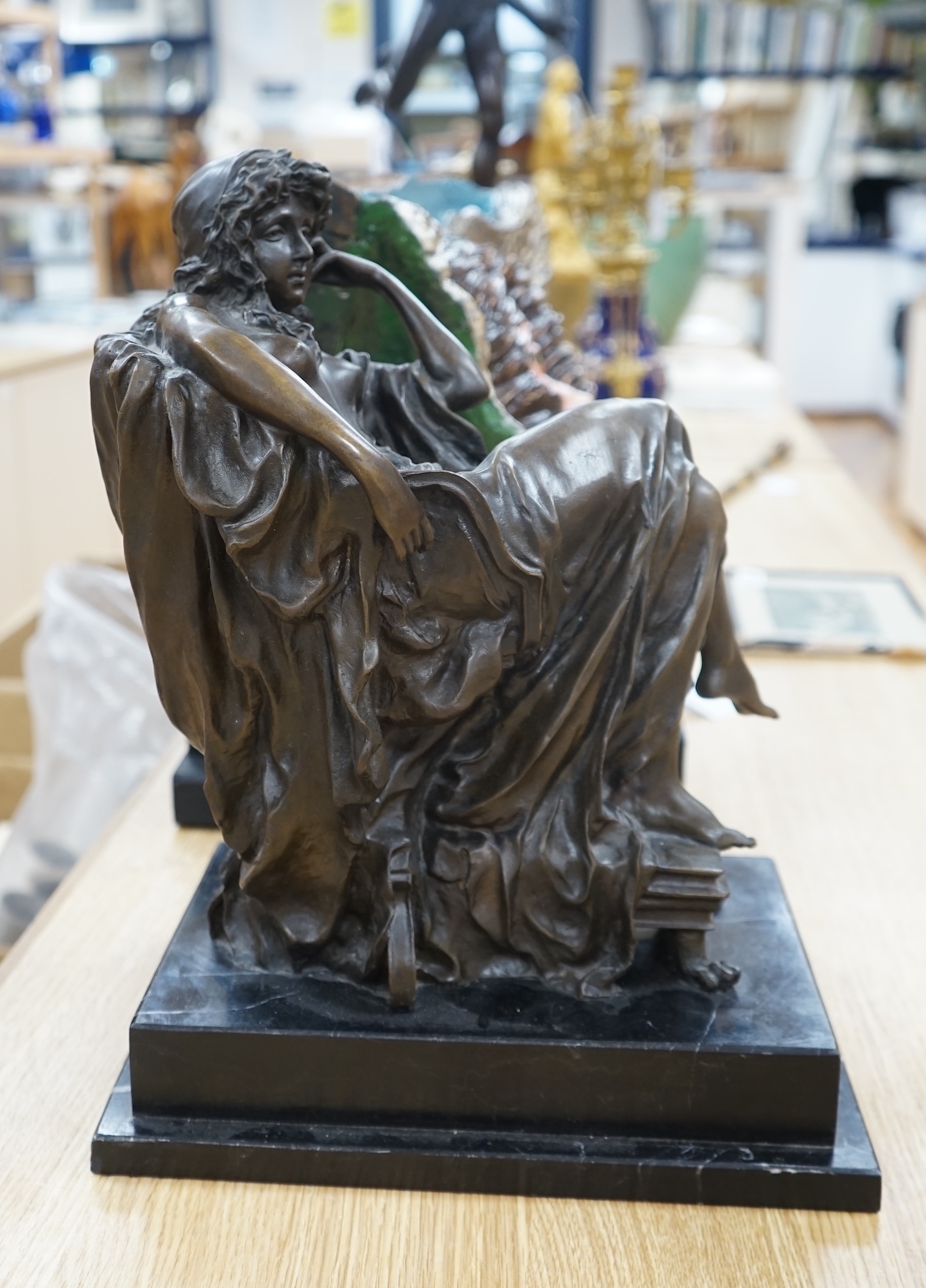 A decorative bronze study of a seated woman, raised on a stepped marble plinth, signed Chiparus, 41cm high. Condition - good